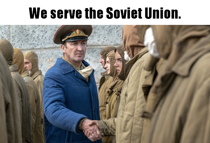 This meme is a still image from a movie or TV show, featuring a character in a Soviet military uniform. The text "We serve the Soviet Union" is written in a bold, distressed font at the top of the image. The character is standing in a group of other soldiers, but his face is the focus of the image, and he's looking directly at the camera with a stern expression.